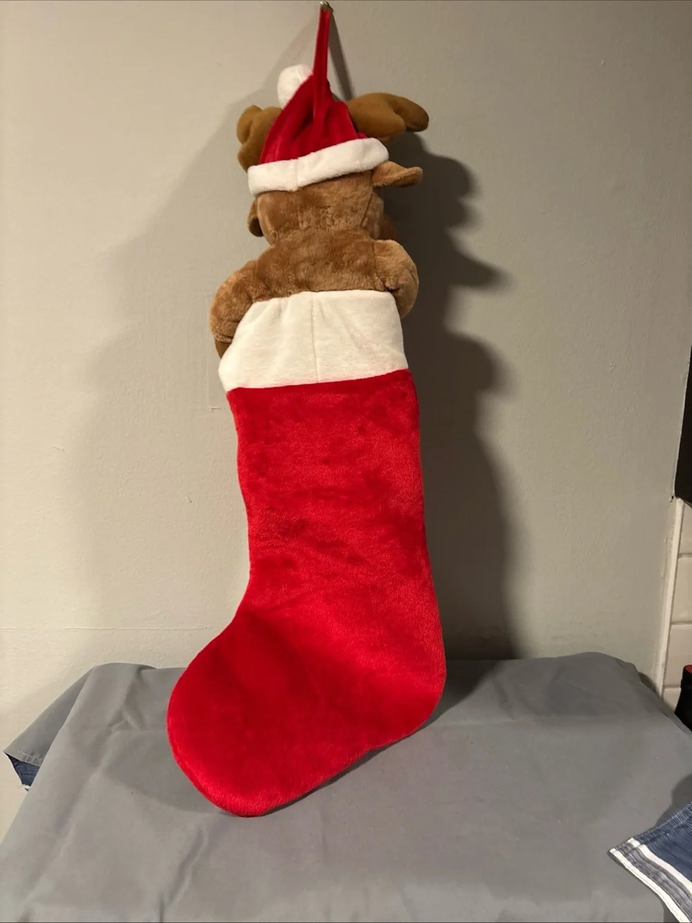 Holiday singing stocking with puppy dog sings jingle bells
